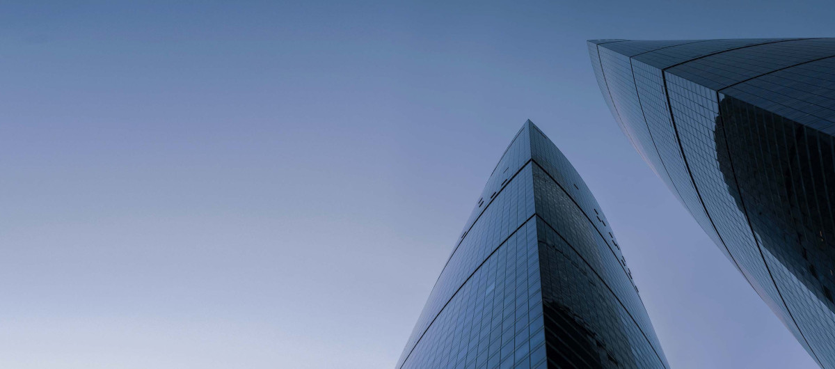 Modern financial district buildings representing global capital markets